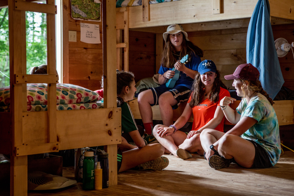 girls hanging out in cabin