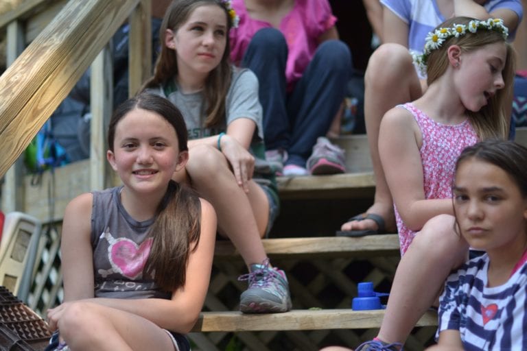 girls hanging out on cabin stairs