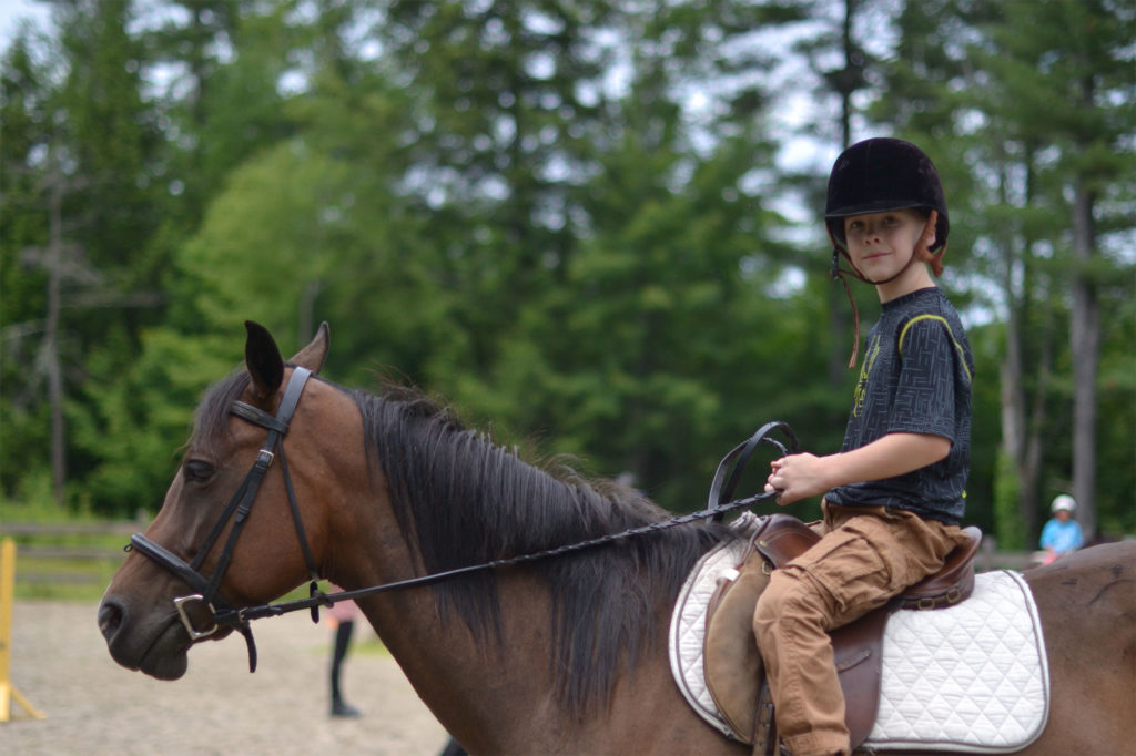 boy riding horse